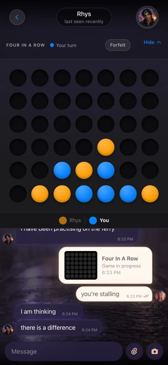A Four In A Row board open above an Embraces AI companion chat, with the companion teasing 'you're stalling' and the user replying 'I am thinking' mid-game